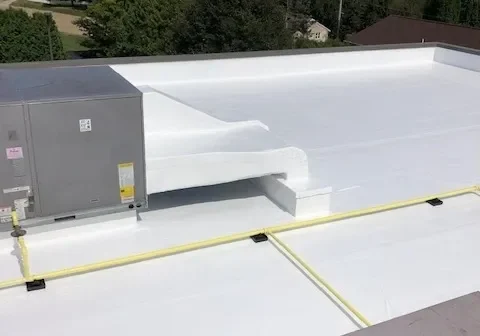 White flat commercial rooftop with HVAC units